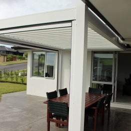 Bask freestanding louvre roof finished in a colour matching house